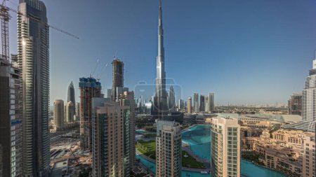 Photo for Panorama showing Dubai Downtown skyline cityscape with tallest skyscrapers around aerial . Construction site of new towers and busy roads with traffic from above - Royalty Free Image