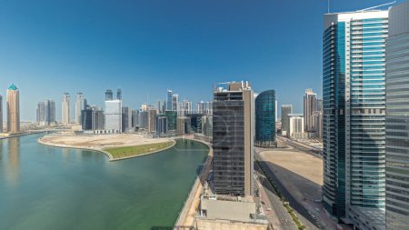 Téléchargez les photos : Panorama showing cityscape skyscrapers of Dubai Business Bay with water canal aerial . Modern skyline with towers and waterfront. A center of international business - en image libre de droit