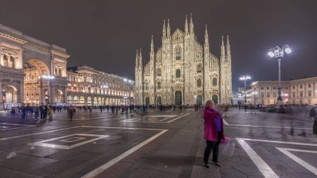 Photo for Panorama showing Milan Cathedral and historic buildings night timelapse. Duomo di Milano is the cathedral church located at the Piazza del Duomo square in Milan city in Italy - Royalty Free Image