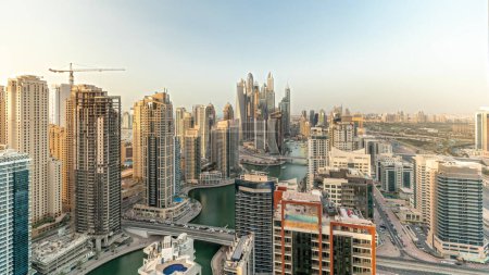 Foto de Panorama showing various skyscrapers in tallest recidential block in Dubai Marina aerial with artificial canal. Many towers and yachts - Imagen libre de derechos