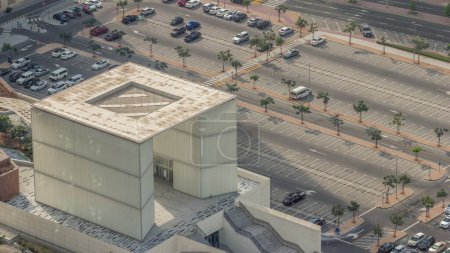 Photo for Big parking lot near mall crowded by many cars aerial view. Vehicles moves in and out. Fast moving shadows - Royalty Free Image