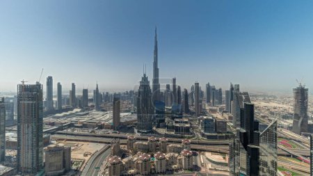 Photo for Panorama showing aerial view of tallest towers in Dubai Downtown skyline and highway. Financial district and business area in smart urban city. Skyscraper and high-rise buildings - Royalty Free Image