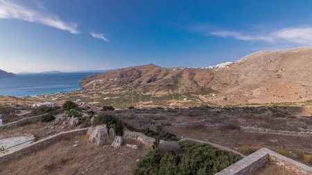 Photo for Panorama showing Amorgos island aerial timelapse from above. Traditional Greece - white houses on hills and turquoise sea, Cyclades - Royalty Free Image