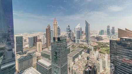 Photo for Panorama showing many futuristic skyscrapers in financial district business center in Dubai on Sheikh Zayed road. Aerial view from above with clouds - Royalty Free Image