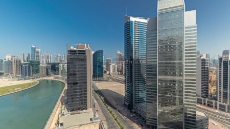 Photo for Panorama showing cityscape skyscrapers of Dubai Business Bay with water canal aerial. Modern skyline with towers and waterfront. A center of international business - Royalty Free Image
