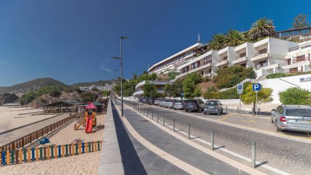 Photo for Panorama showing the coastline and waterfront road of the village of Sesimbra timelapse, in the middle of the Atlantic Ocean. View of the beach. Portugal - Royalty Free Image