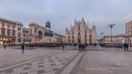 Photo for Panorama showing Milan Cathedral and historic buildings day to night transition timelapse. Duomo di Milano is the cathedral church located at the Piazza del Duomo square in Milan city in Italy - Royalty Free Image