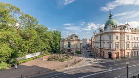 Photo for Panorama showing Theater Square with Main Post Office building aerial timelapse and Polish Theater, both built in 1890s, view from the Castle hill. Traffic on the street. Bielsko-Biala, Poland - Royalty Free Image