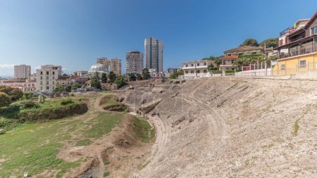Photo for Panorama showing the Amphitheatre of Durres (Amphitheatrum Dyrrhachium) timelapse from above. Ruins of the ancient Roman amphitheater in the center of Durres, Albania. - Royalty Free Image