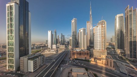 Téléchargez les photos : Vue panoramique aérienne de Dubai Downtown skyline avec de nombreuses tours timelapse. Ombres se déplaçant rapidement le soir. Zone d'affaires dans la ville urbaine intelligente. gratte-ciel et immeubles de grande hauteur d'en haut, Émirats arabes unis. - en image libre de droit