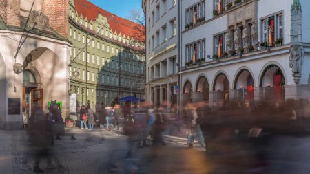Photo for Kaufingerstrasse, shopping street and pedestrian zone in Munich downtown near the Marienplatz timelapse. Historic buildings with people walking around. Entrance to a museum. Bavaria, Germany - Royalty Free Image