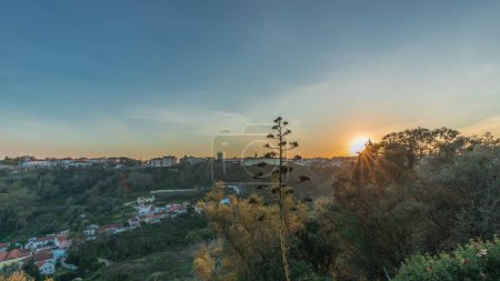 Photo for Panorama showing sunset over the Castle of Almourol on hill in Santarem aerial timelapse. A medieval castle atop the islet of Almourol in the middle of the Tagus River and houses. Portugal - Royalty Free Image