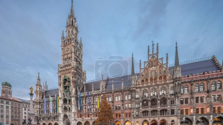 Photo for Marienplazt Old Town Square with the New Town Hall timelapse hyperlapse. Neues Rathaus and Town Hall Clock Tower Glockenspiel. Munich skyline, downtown cityscape during sunset. Bavaria, Germany - Royalty Free Image