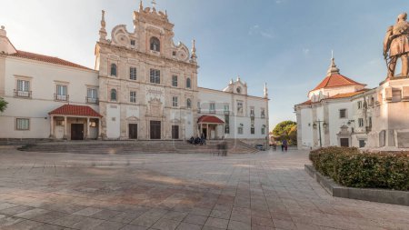 Panorama showing Sa da Bandeira Square with a view of the Santarem See Cathedral aka Nossa Senhora da Conceicao Church timelapse, built in the 17th century Mannerist style. Walking area. Portugal