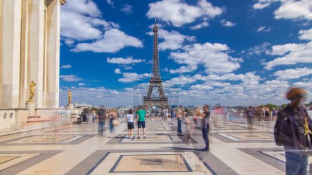 Photo for Famous square Trocadero with Eiffel tower in the background timelapse hyperlapse forward motion. Trocadero and Eiffel tower are the most visited attractions of Paris. Blue cloudy sky at summer day - Royalty Free Image