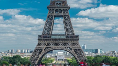 Photo for Champ de Mars and the Eiffel Tower timelapse in a sunny summer day. Paris, France. View from square Trocadero with crowd on a viewpoint - Royalty Free Image