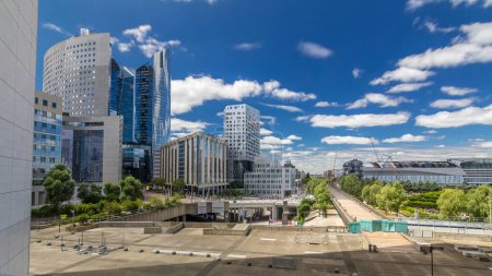 Photo for Skyscrapers of Defense timelapse hyperlapse modern business and financial district in Paris with highrise buildings. View from Grande Arche. Blue cloudy sky and reflections in modern towers. - Royalty Free Image