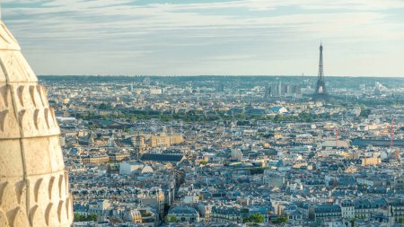 Photo for Panorama of Paris from above timelapse with Eiffel tower, France. Aerial top view over city streets from Montmartre viewpoint. Sunny day with blue cloudy sky. - Royalty Free Image