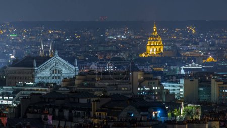 Photo for Paris night cityscape timelapse seen from Montmartre with Garnier opera and Les Invalides golden dome. Top aerial view from viewpoint. Paris, France - Royalty Free Image