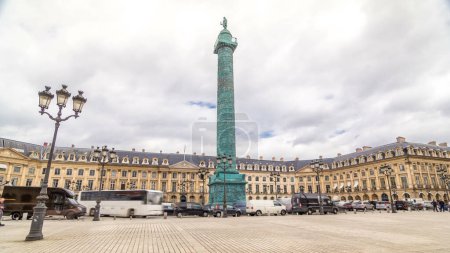 Photo for Vendome column with statue of Napoleon Bonaparte on top on the Place Vendome timelapse hyperlapse. Paris, France. Cloudy sky at summer day and traffic on road - Royalty Free Image