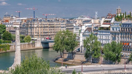 Photo for Panorama of Paris timelapse with Cite Island from observation deck of Arab World Institute (Institut du Monde Arabe) building. Top aerial view. Green trees, Seine river, Blue cloudy sky. France. - Royalty Free Image