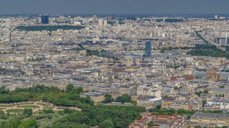 Photo for Top view of Paris skyline from above timelapse. Landmarks of european megapolis with The Luxembourg Garden and Pantheon dome. Bird-eye view from observation deck of Montparnasse tower. Paris, France - Royalty Free Image