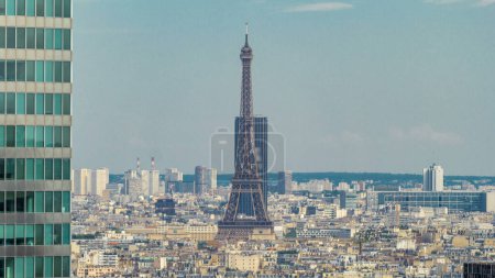 Photo for Paris skyline and Eiffel Tower aerial timelapse from the top of the skyscrapers in Paris business district La Defense. Sunny summer day. Paris, France - Royalty Free Image