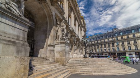 Photo for Palais or Opera Garnier The National Academy of Music facade timelapse hyperlapse in Paris, France. Stairs to the entrance. People walking around and traffic on the street. - Royalty Free Image