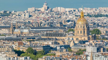 Photo for Aerial panorama above houses rooftops in a Paris timelapse. Evening view with les invalides before sunset. Close up view to dome - Royalty Free Image