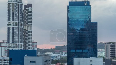 Photo for Aerial cityscape of Singapore downtown of modern architecture with skyscrapers timelapse, view from above in chinatown district before sunset - Royalty Free Image