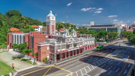 Photo for Street traffic near the fire station of Singapore aerial timelapse. The Central Fire Station is the oldest existing fire station in Singapore on Hill street - Royalty Free Image