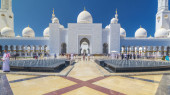 Sheikh Zayed Grand Mosque timelapse hyperlapse in Abu Dhabi, the capital city of United Arab Emirates. Front view with fountains. Blue sky at sunny day tote bag #707666646