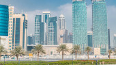 The skyline of Doha seen from Park timelapse, Qatar. Trees and palms on foreground. Modern skyscrapers and towers on background. Traffic on road Longsleeve T-shirt #707668986