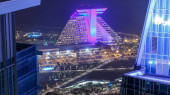 Doha West Bay view with hotel park night timelapse, Doha, Qatar, Middle East. Aerial top view. Traffic on the road puzzle #707669482