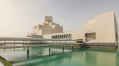 Qatar's museum of Islamic Art timelapse hyperlapse on its man-made island beside Doha Corniche, with dhows moored in the bay surrounding it Longsleeve T-shirt #707669850