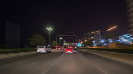 Photo for Drive on streets through the traffic in the city highway timelapse hyperlapse drivelapse in Kuwait. Kuwait, Middle East - Royalty Free Image