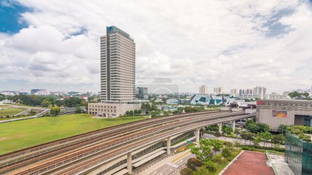 Photo for Jurong East Interchange metro station aerial timelapse, one of the major integrated public transportation hub in Singapore. Tower on a background. Passenger can change between Bus and Rail - Royalty Free Image