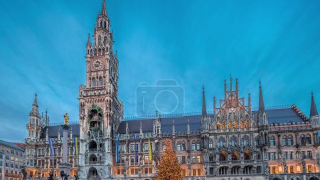 Photo for Marienplazt Old Town Square with the New Town Hall timelapse hyperlapse. Neues Rathaus and Town Hall Clock Tower Glockenspiel. Munich skyline, downtown cityscape during sunset. Bavaria, Germany - Royalty Free Image