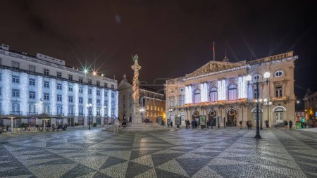 Photo for Panorama showing Municipal square with City Hall architecture decorated for Christmas and night celebrations night timelapse. People walking around. Lisbon, Portugal - Royalty Free Image