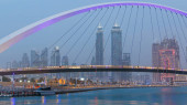 Illuminated Pedestrian Bridge over the Dubai Water Canal night which links Dubai Creek to Jumeirah Beach weaving through Deira, Downtown Dubai and Safa Park. Skyscrapers skyline. United Arab Emirates mug #710556444