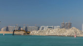 Excavator building a new part on the Palm Jumeirah timelapse. Port terminal construction. Dubai skyline on background Longsleeve T-shirt #710559950