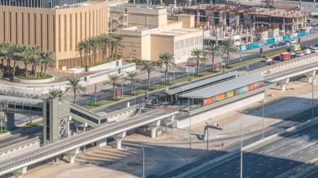 Aerial view of Dubai Tram in Dubai marina timelapse. Dubai Tram runs in a loop around Marina and JBR area and links up with the Dubai Metro and the Palm Monorail.