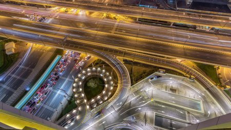 Photo for Aerial view of highway interchange in Dubai downtown night. Al Saada street and Financial center road. Cityscapes traffic bridge, logistics. Roads and lanes Crossroads, Dubai, United Arab Emirates - Royalty Free Image