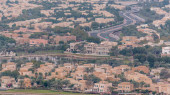 Aerial view of apartment houses and villas in Dubai city timelapse near jumeirah lake towers district, United Arab Emirates. Top view from skyscraper Poster #714800432
