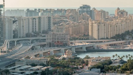 Photo for Palm Jumeirah Highway bridge aerial timelapse. View from Internet city with traffic. Dubai, United Arab Emirates - Royalty Free Image
