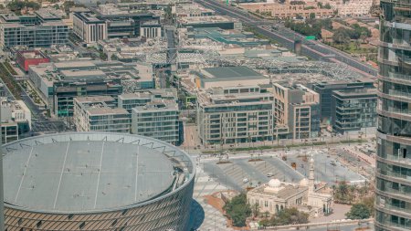 Aerial view to Dubai City Walk and arena timelapse. New modern part with European-style streets, shops and restaurants near downtown