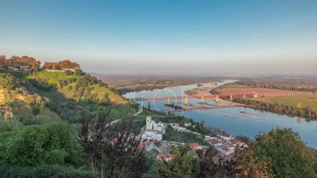 Panorama showing the Castle of Almourol on hill in Santarem aerial timelapse. A medieval castle atop the islet of Almourol in the middle of the Tagus River with bridge over it. Portugal