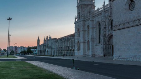 Photo for Mosteiro dos Jeronimos day to night transition timelapse (Hieronymites Monastery), located in the Belem district of Lisbon, Portugal. Typical example of the Manueline style. UNESCO World Heritage Site - Royalty Free Image