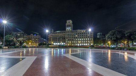 Photo for Timelapse Hyperlapse of Illuminated Placa de Catalunya in Central Barcelona. A Large Square Regarded as the City Center, Featuring a Central Fountain and Flowerbed as a Backdrop to the Nightly Bustle - Royalty Free Image