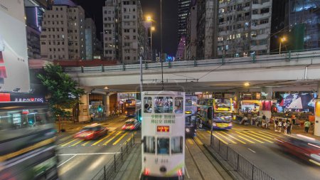 Photo for View from double-decker tram on street of HK timelapse hyperlapse drivelapse. Hong Kong Tramways is a tram system in Hong Kong, being one of the earliest forms of public transport in the metropolis - Royalty Free Image